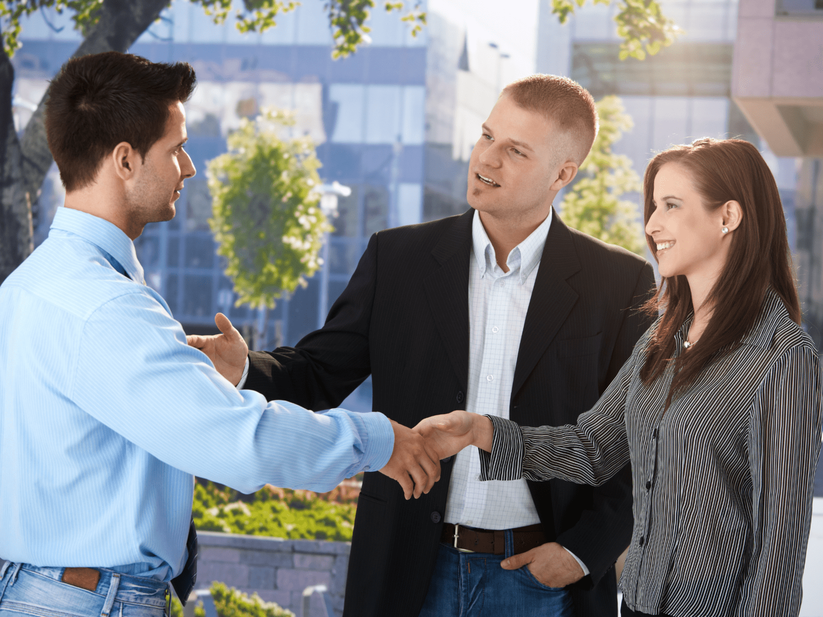 three people making deals